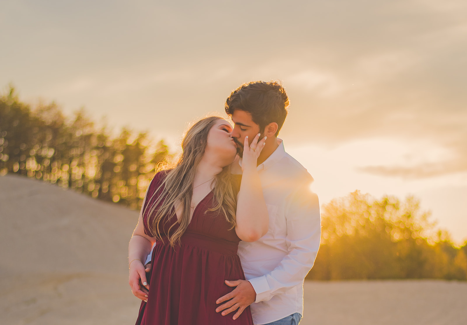 Kissing Engaged Couple at Sunset on Rhode Island Sand Dunes